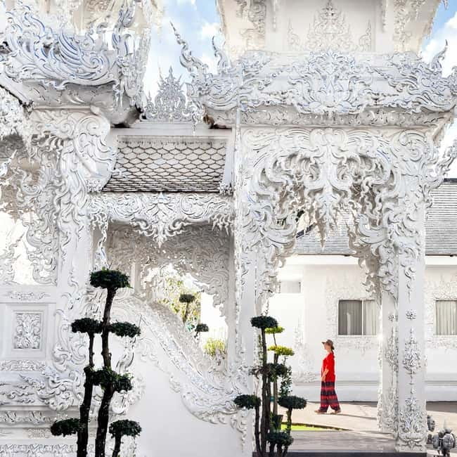 Chiang Mai: Chiang Rai Famous Temples & Hot Springs Day Trip - Entering Wat Rong Khun: The White Temple in Real Life