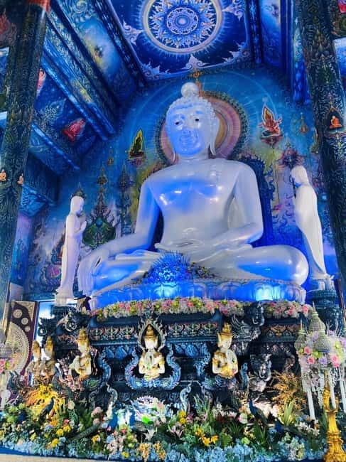 Chiang Mai: Chiang Rai White, Blue & Black Temples Day Tour - Wat Rong Suea Ten (Blue Temple): calm worship spaces in blue-and-gold tones