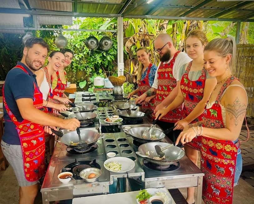 Chiang Mai: Cooking Class, Market & Thai Herbs Garden Tour - Curry paste from scratch: pounding flavors into a Thai kitchen tool