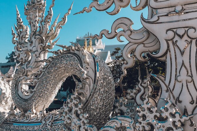 Chiang Rai Famed Temples and Golden Triangle Tour from Chiang Mai - Wat Rong Suea Ten: Blue Temple Beauty in a Short Window