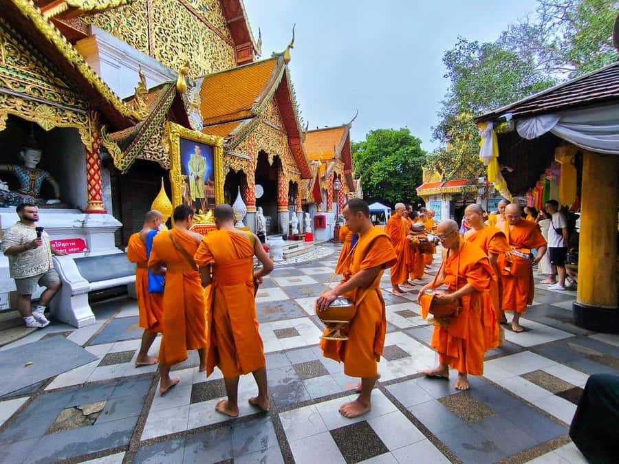 Early morning Doi Suthep with monk chanting and alms - Monk chanting and the alms moment at around 7:00 am