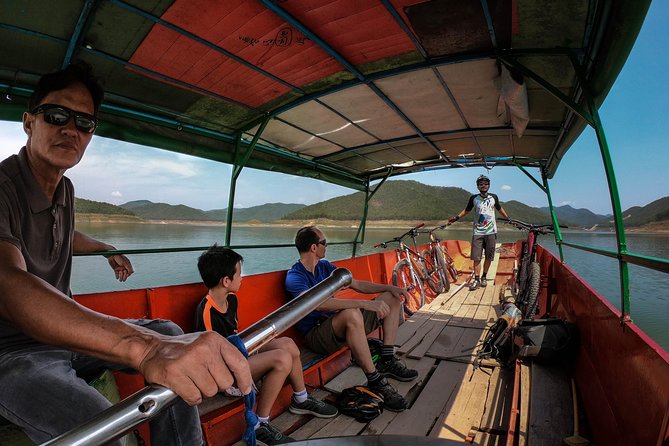 Sticky Waterfall Cycling Tour - From Mae Kuang Reservoir to the trail: the longtail boat opener